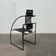Postmodern black Quinta chair in perforated metal by Mario Botta for Alias, 1980s.