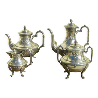 Four-piece service Antique tea/coffee in silver metal. Décor style Louis XVI