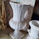 Set of 2 footed vases, 18 cm high and 10 cm high amphora.