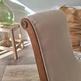 Vintage gondola armchair in beige linen fabric.