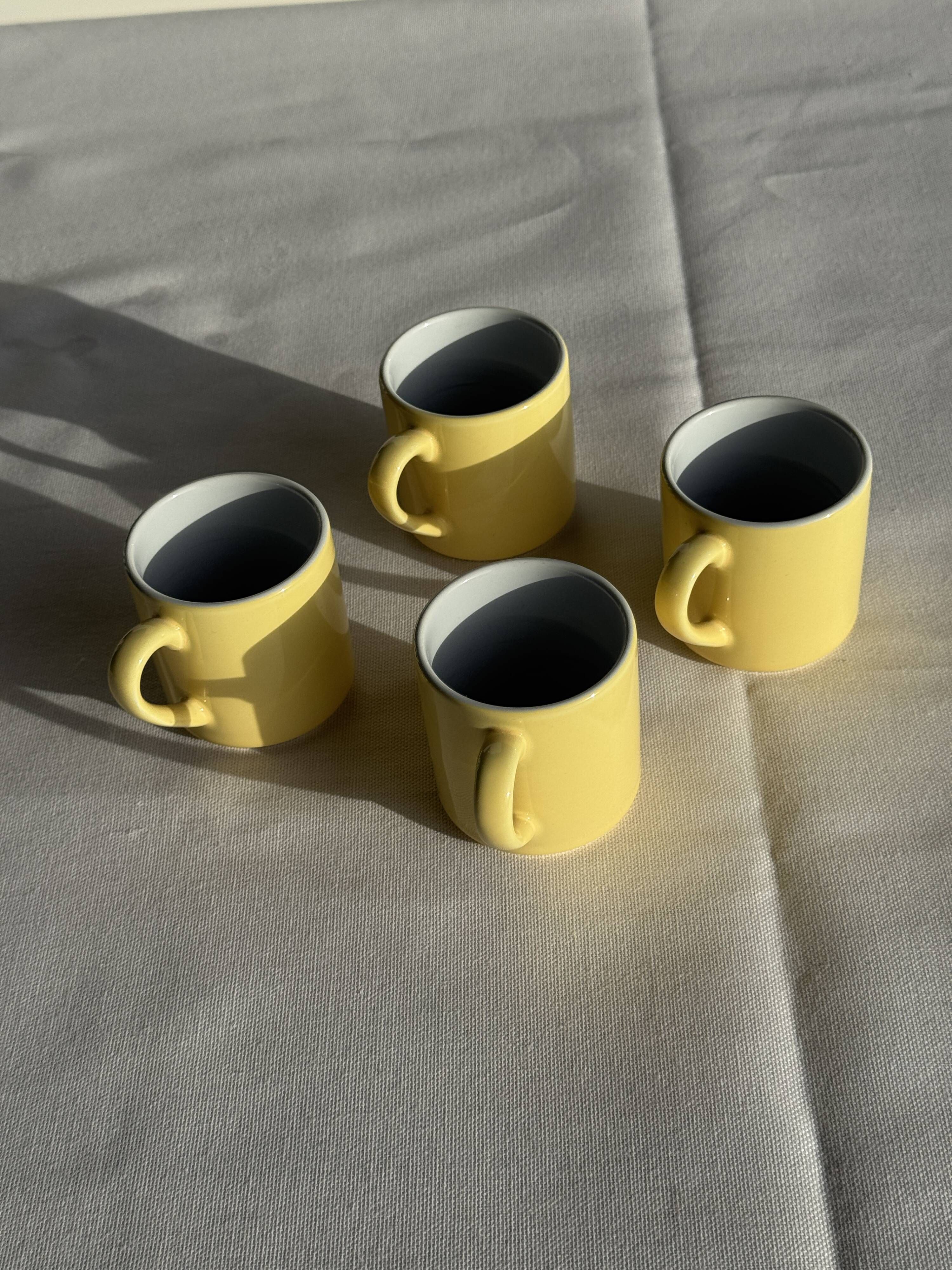Set of 4 vintage yellow Italian espresso cups and saucers.