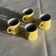 Set of 4 vintage yellow Italian espresso cups and saucers.