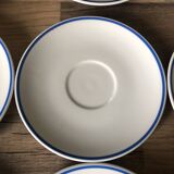 Set of 12 white porcelain saucers with blue edging