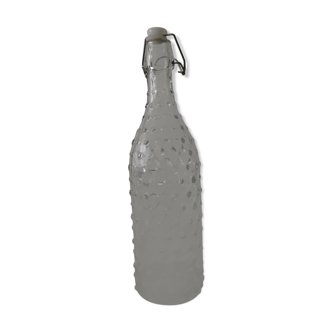 Clear bottle with pegs