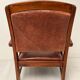 Paire de fauteuils style colonial en tech et cuir vintage