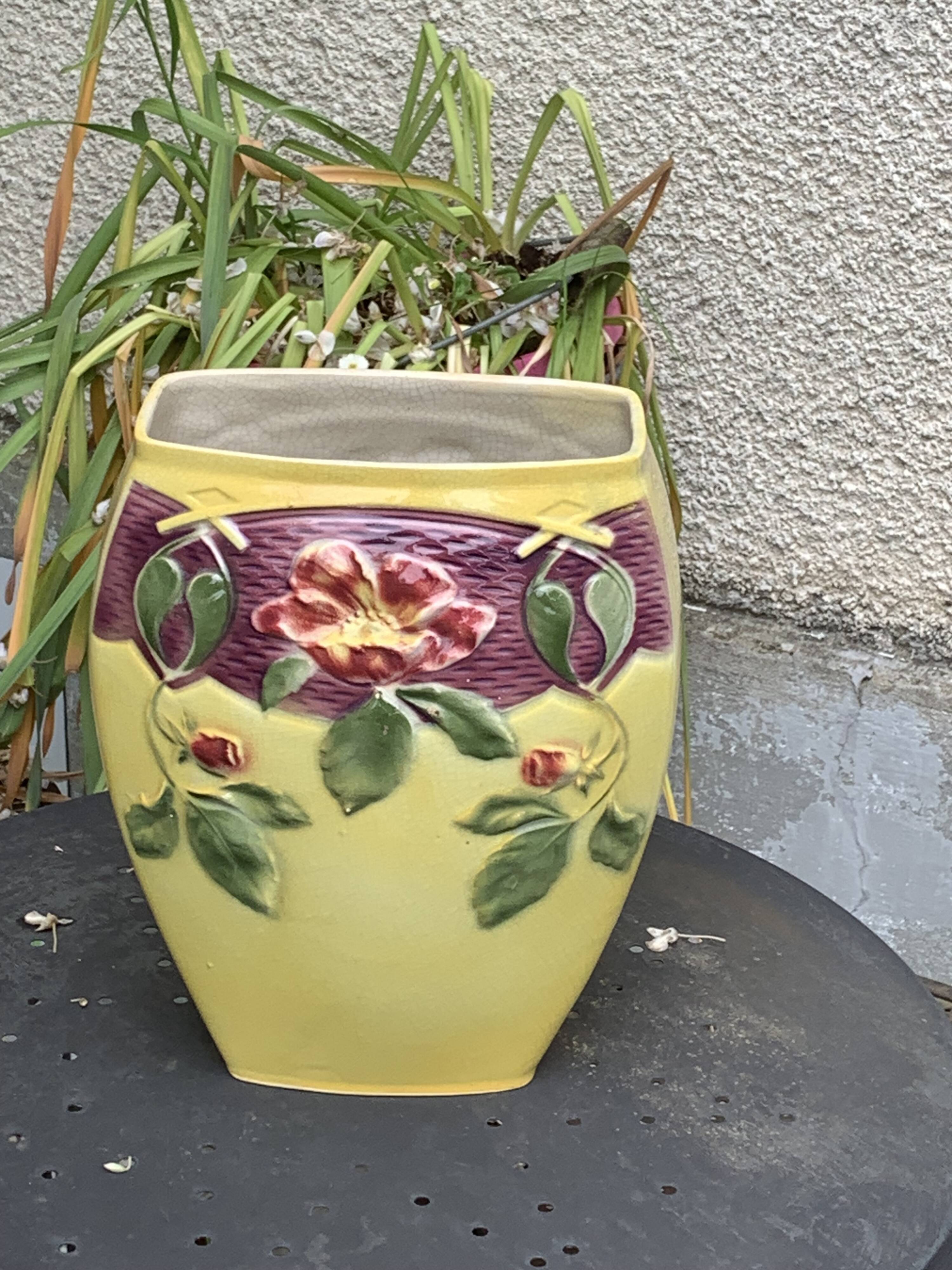 Yellow glazed ceramic slip vase with hawthorn pink flower motif