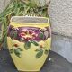 Yellow glazed ceramic slip vase with hawthorn pink flower motif