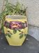 Yellow glazed ceramic slip vase with hawthorn pink flower motif