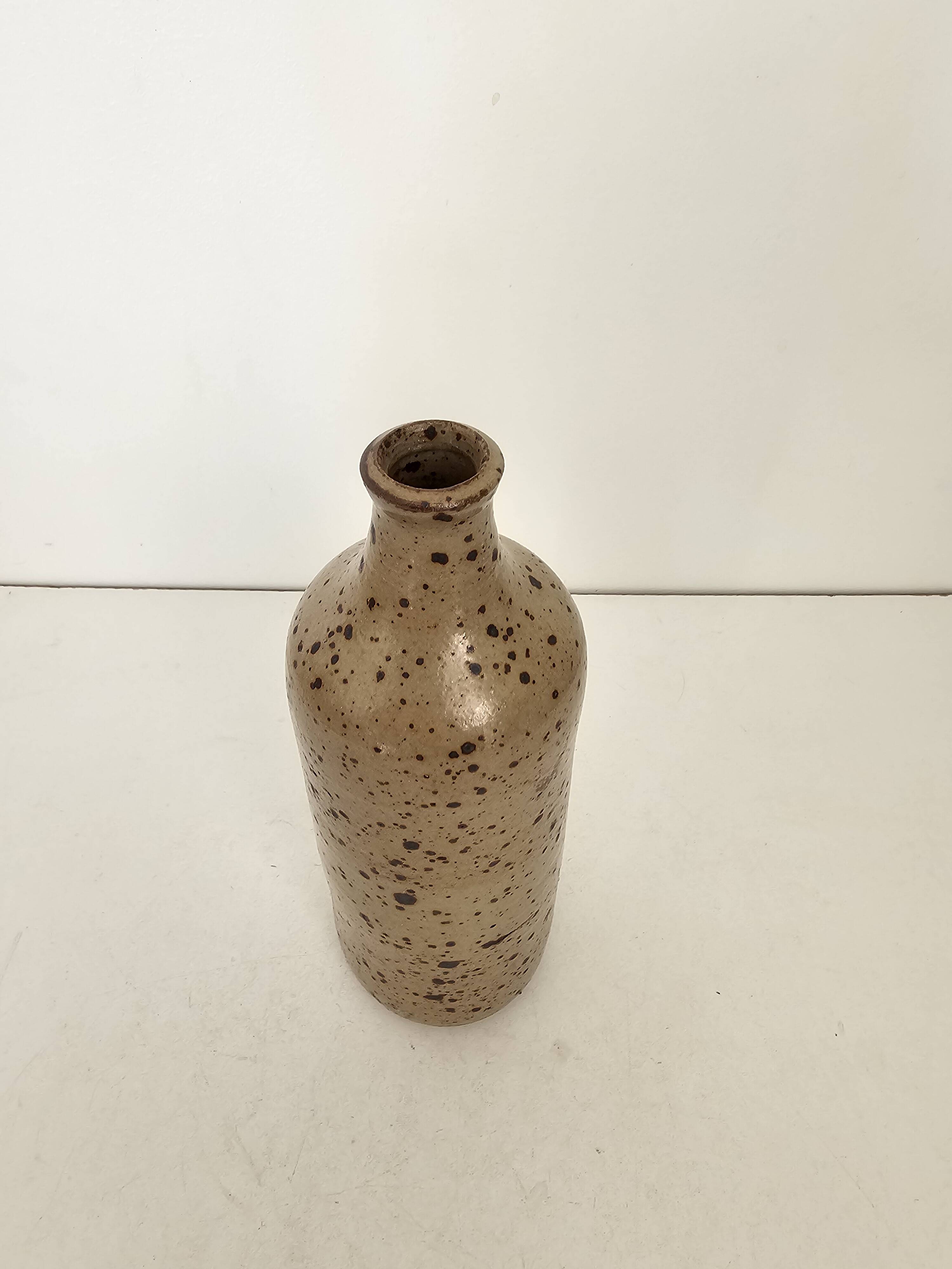 Pyrite stoneware single-flower vase in the shape of a bottle signed Aular?