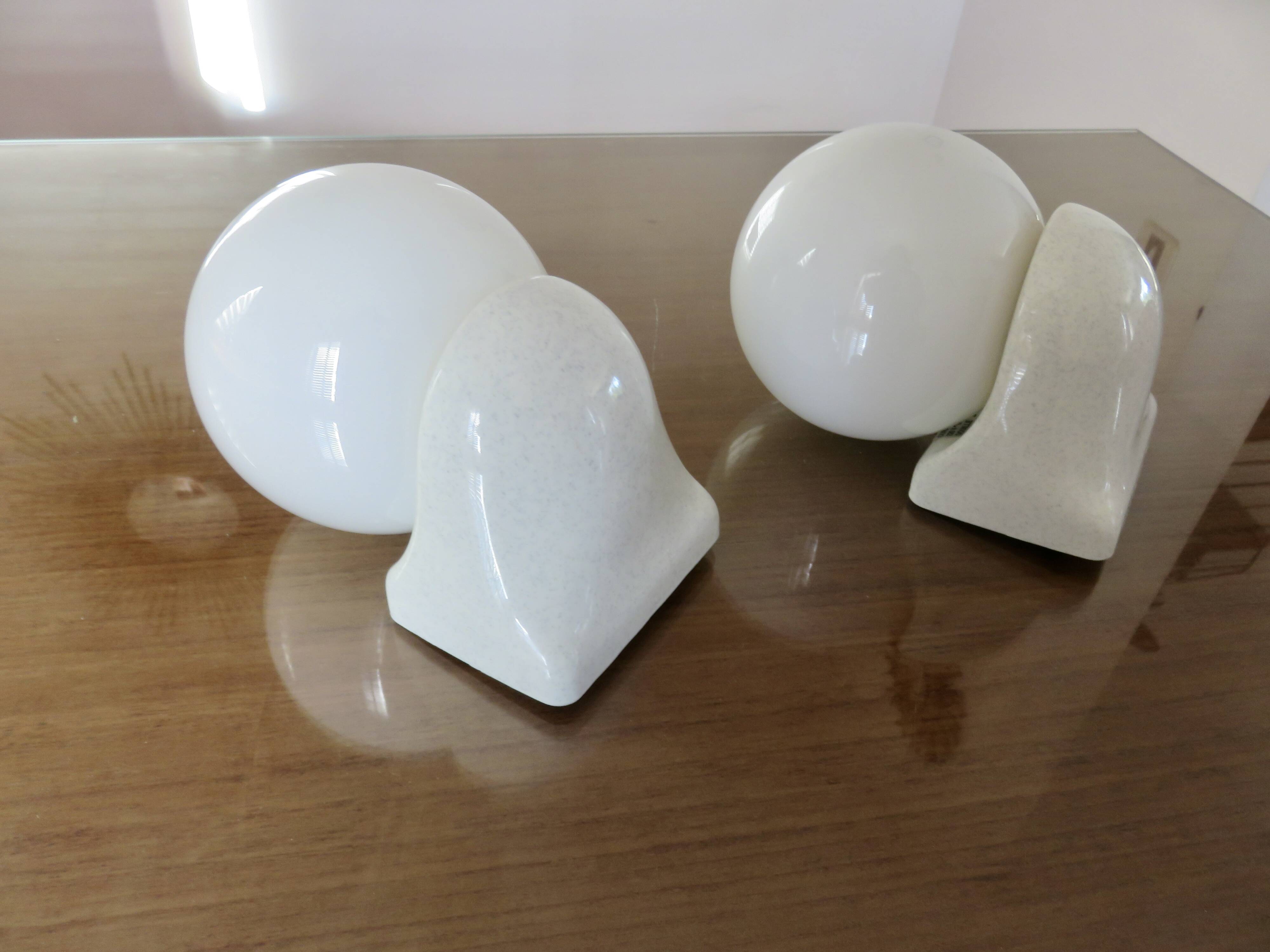 Pair of streamline opaline wall lights from the 80s