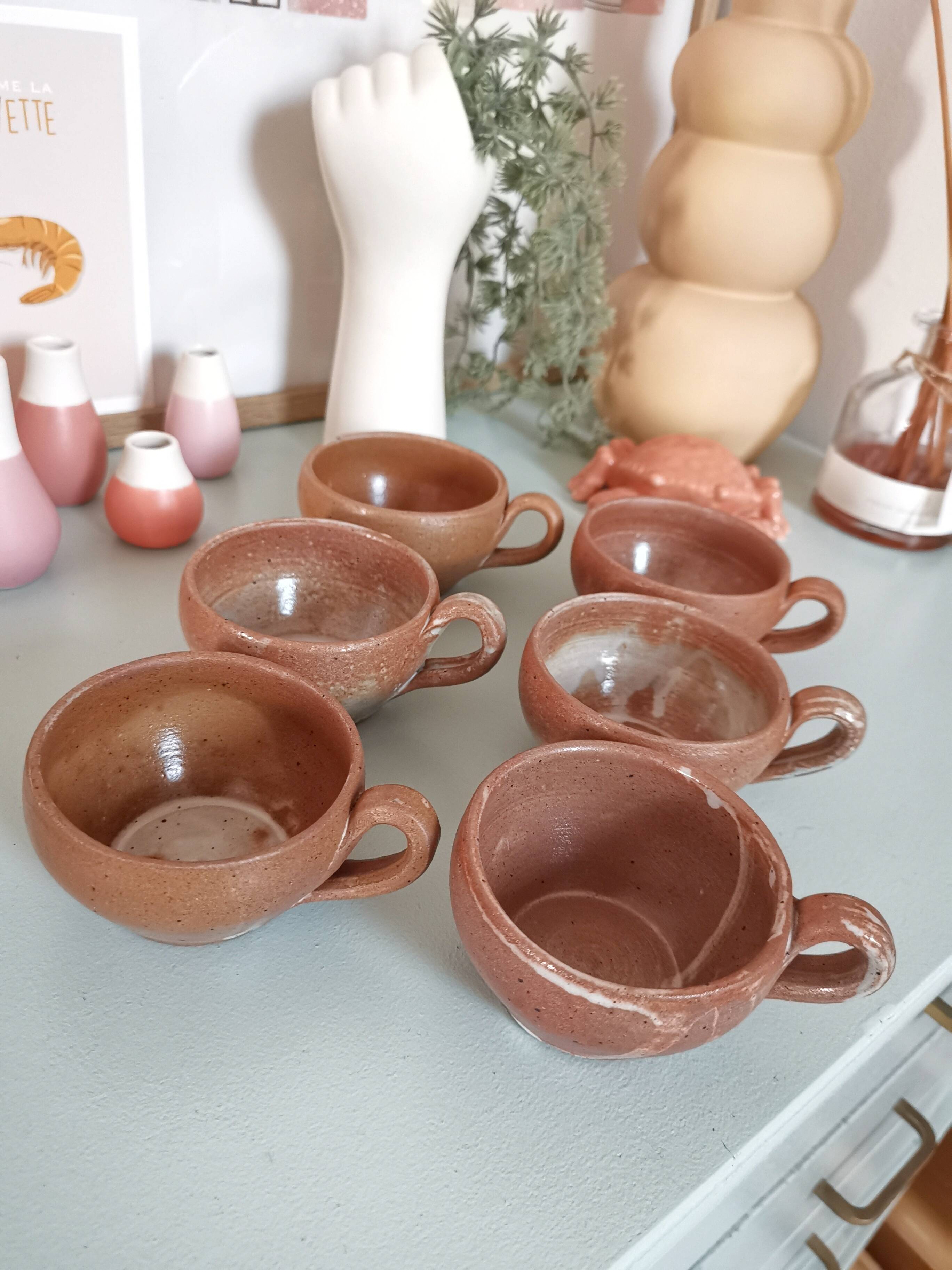 Set of vintage stoneware cups and saucers