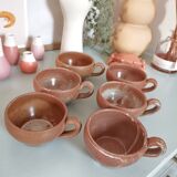 Set of vintage stoneware cups and saucers