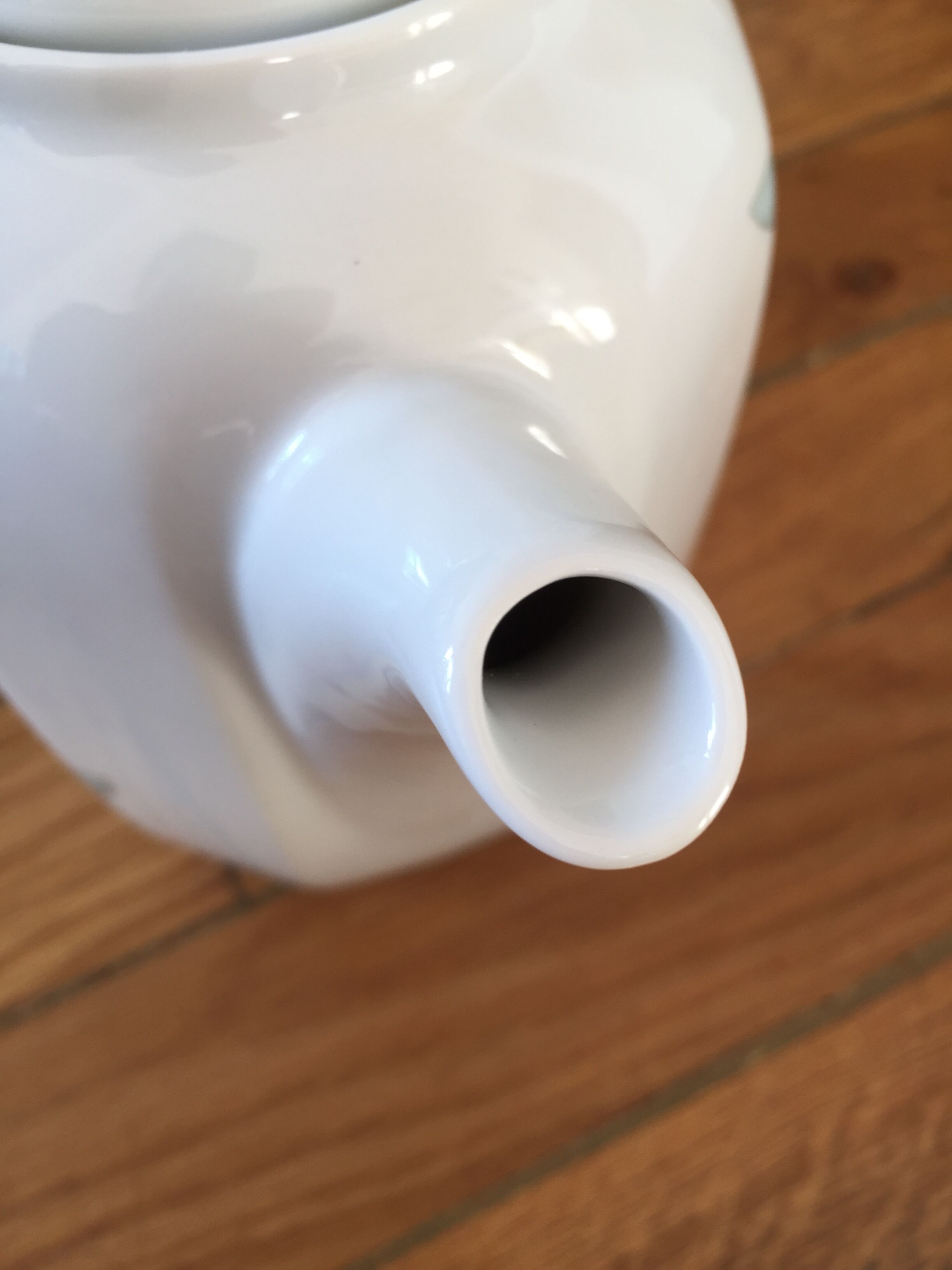 Vintage porcelain coffee or teapot with milk jug