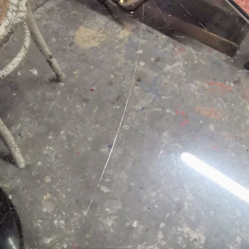 Vintage tulip foot table and smoked glass