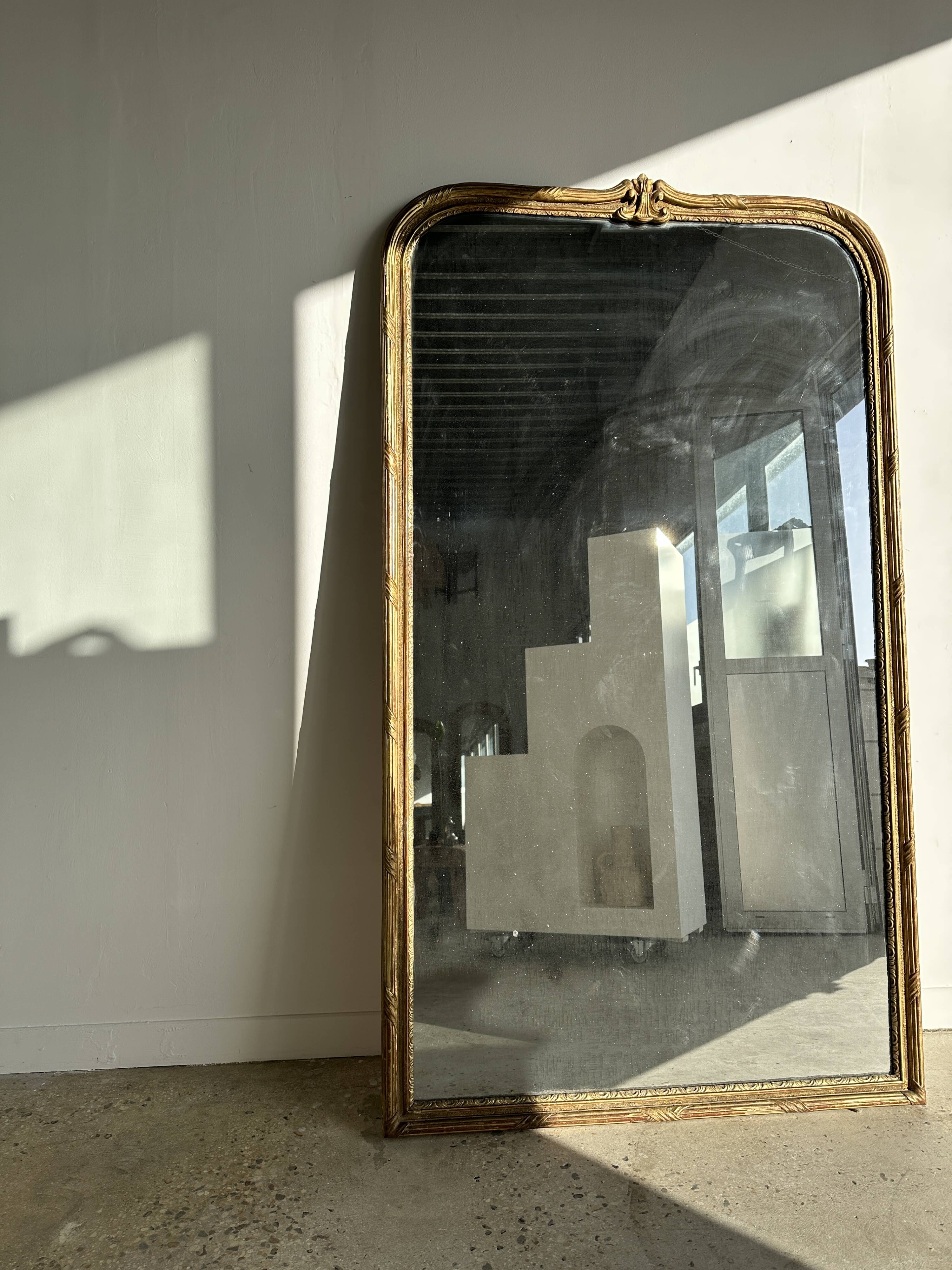 Large gilded mirror 19th century rounded corners mercury glass Louis XVI style