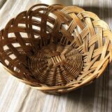 Large vintage twisted wicker basket on a stand