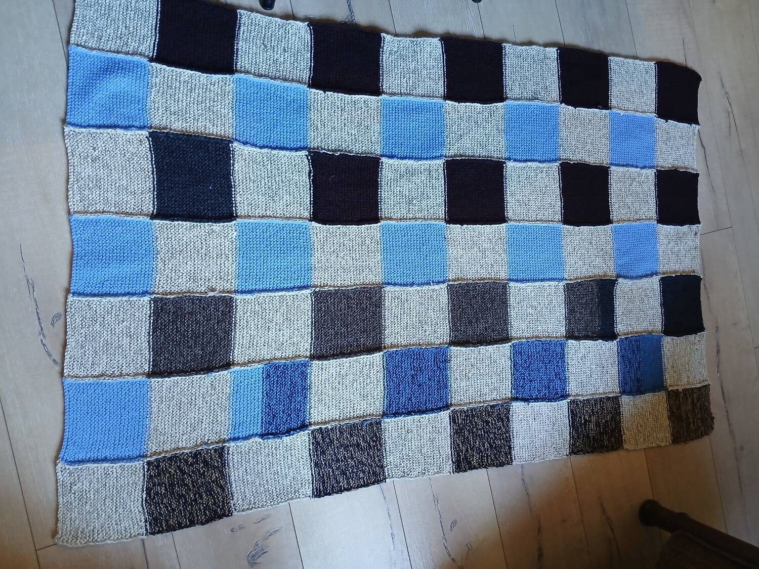 Hand knitted patchwork plaid