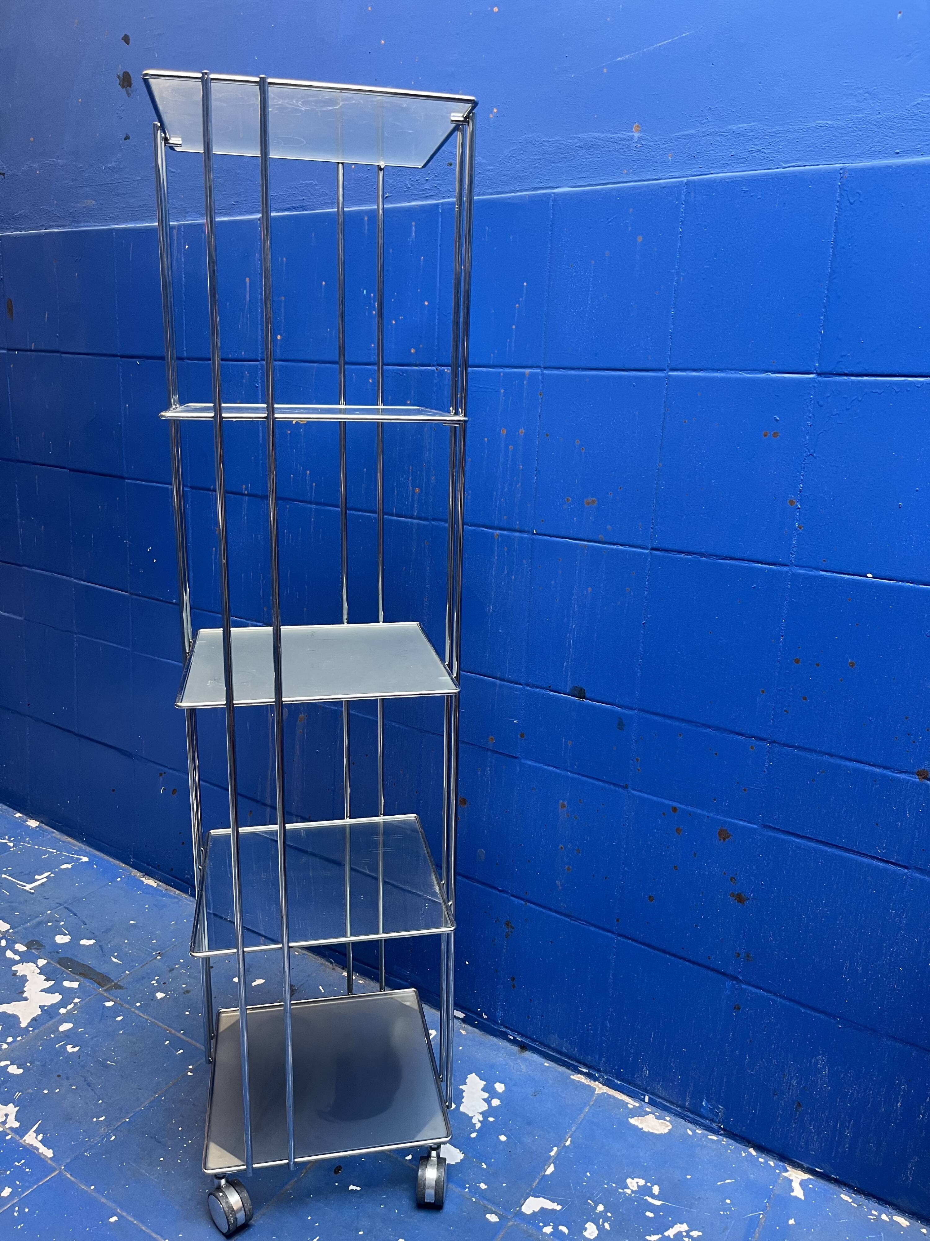 chrome and glass shelving unit on wheels from the 90s