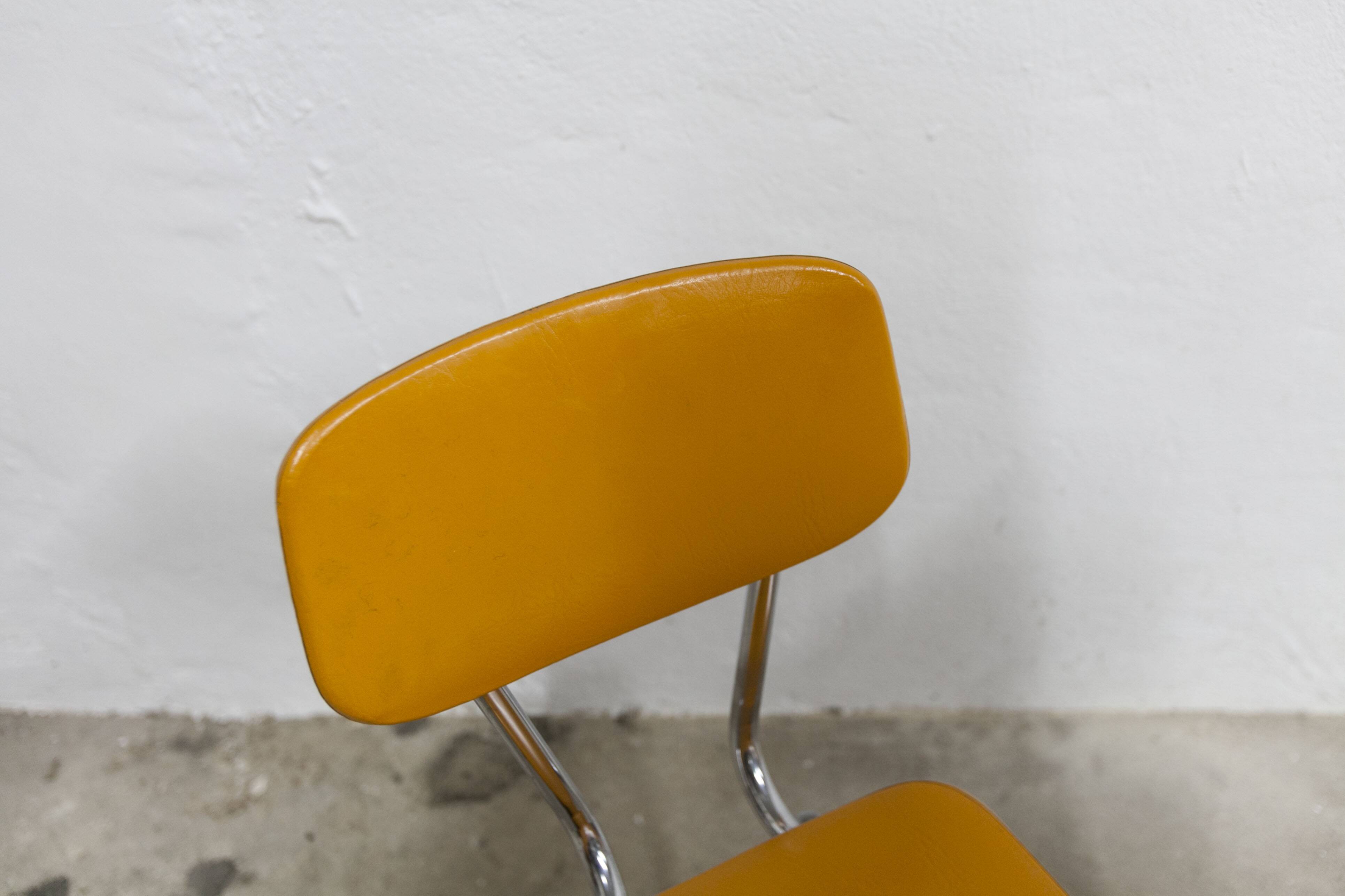 Pair of mustard-colored 70s welded Skai chairs