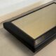 Vintage coffee table covered in leather, smoked mirror top and chrome legs.