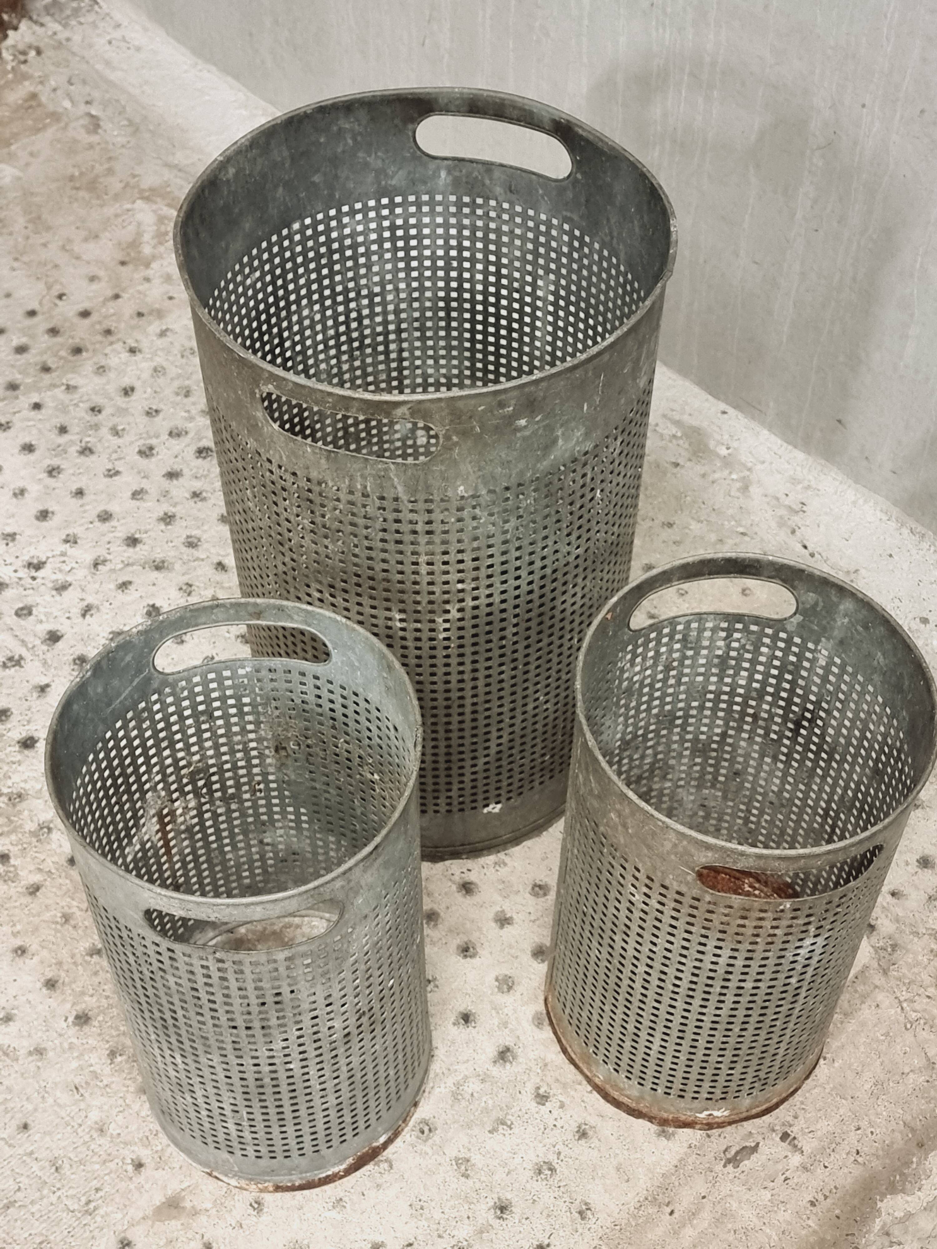 Vintage set of perforated metal waste bins