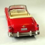 Red Cadillac 50s model car, made of metal, vintage from the 1970s