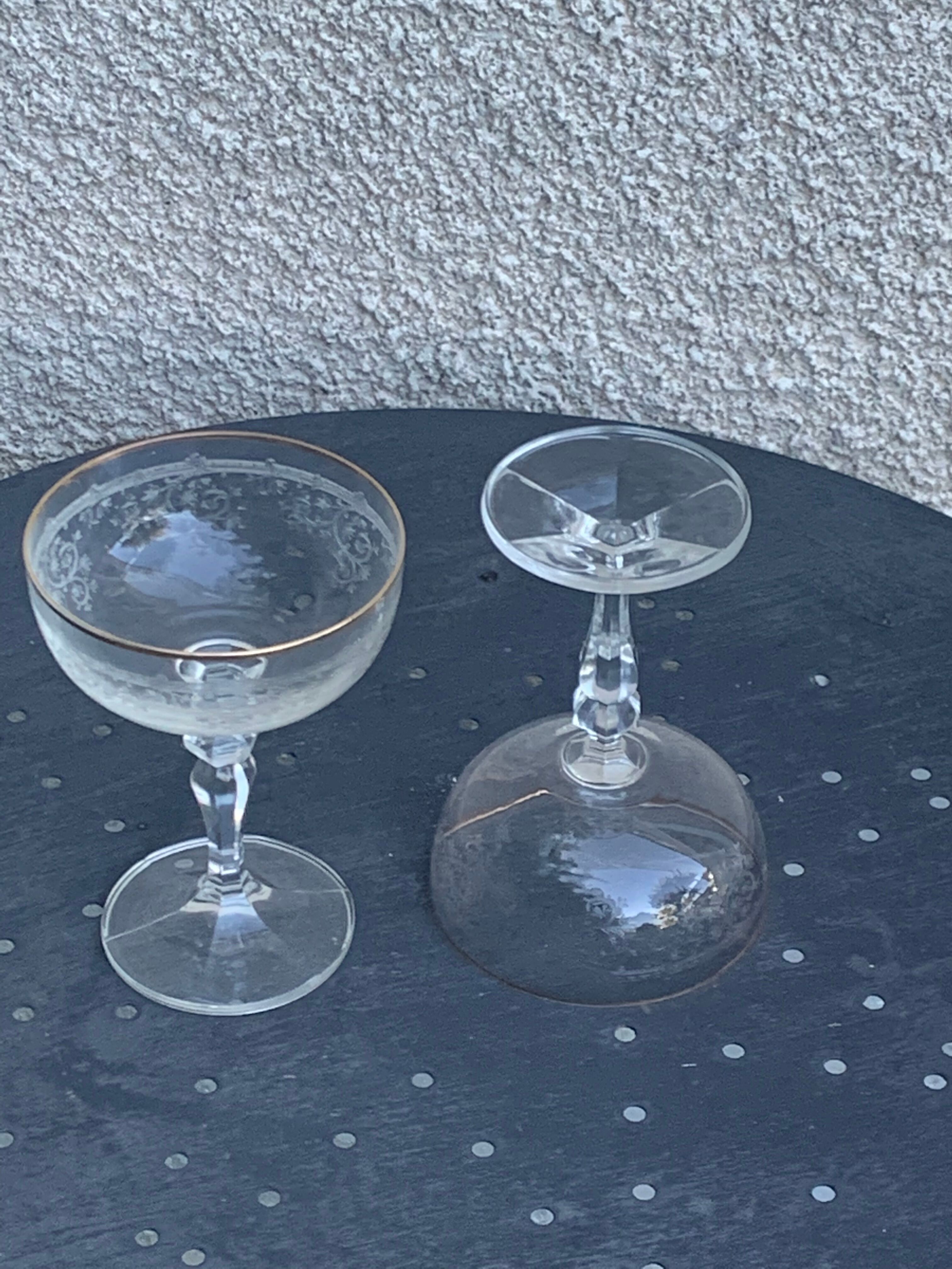 Two crystal champagne glasses and gilded borders antique engraved pattern