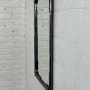 Mirror in black metal and brass with gunmetal finish