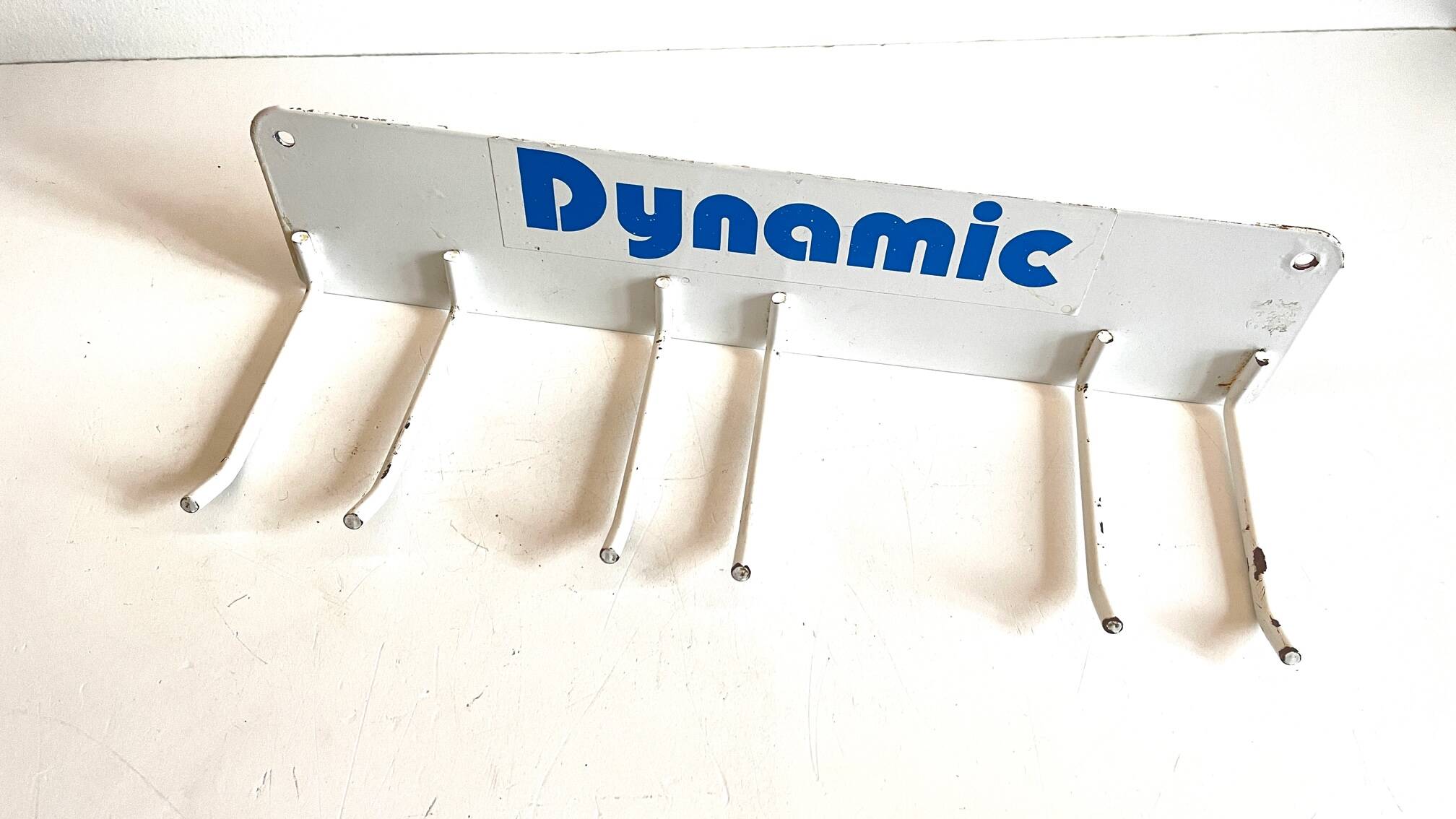 Vintage white metal wall trade coat rack
