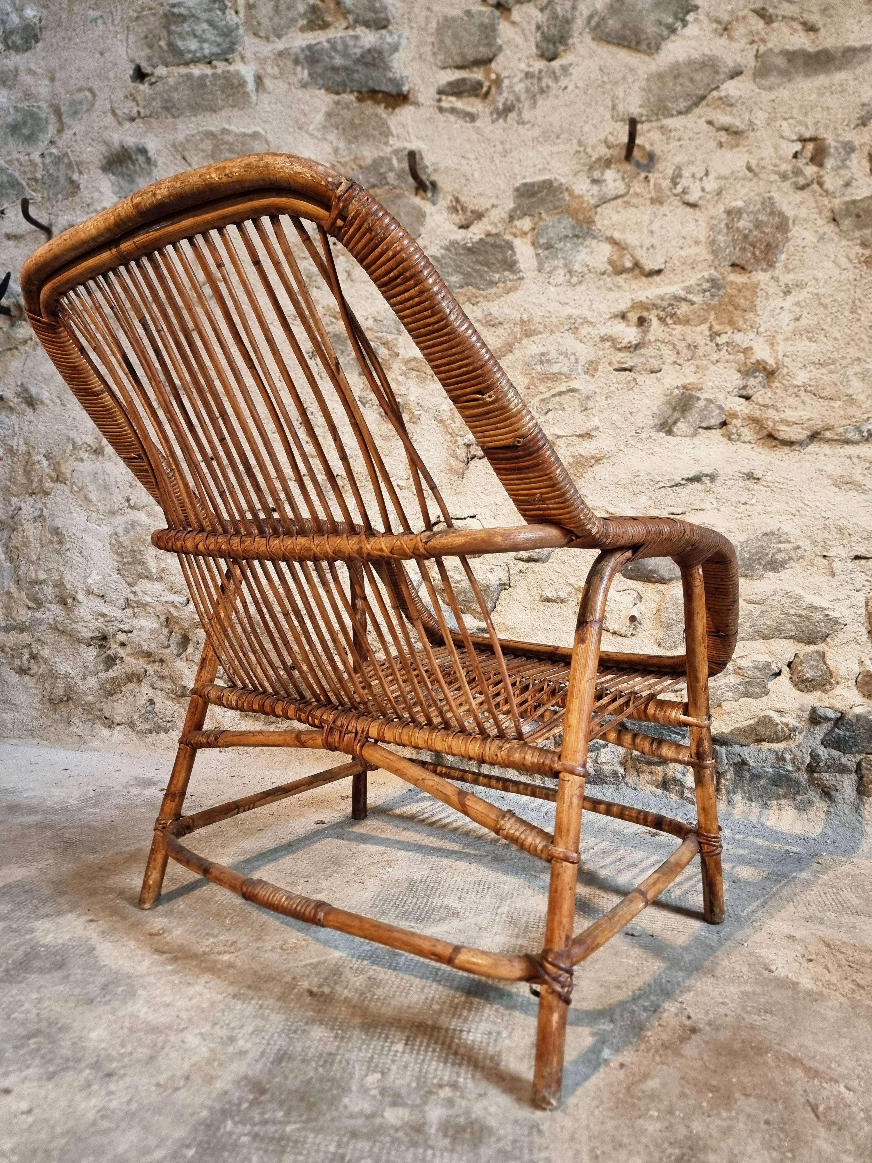 Vintage rattan lounge set, French wicker armchairs and round table, circa 1930–1950.