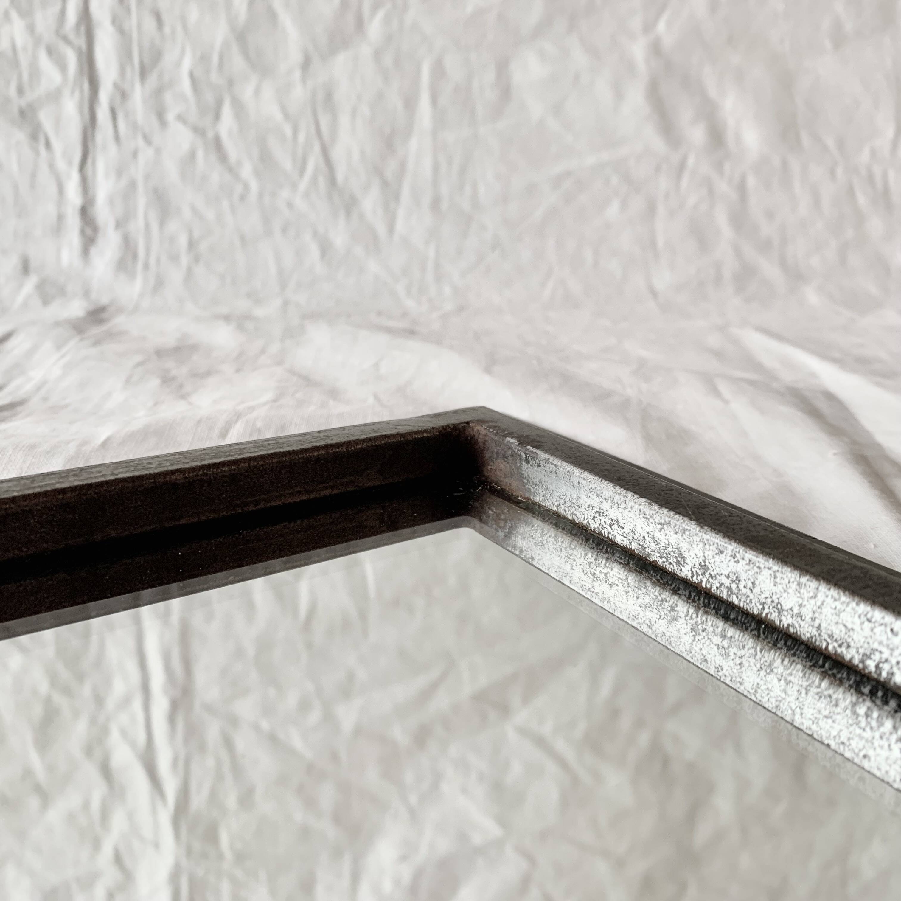 Vintage wall mirror in varnished steel decorated with a rose in relief