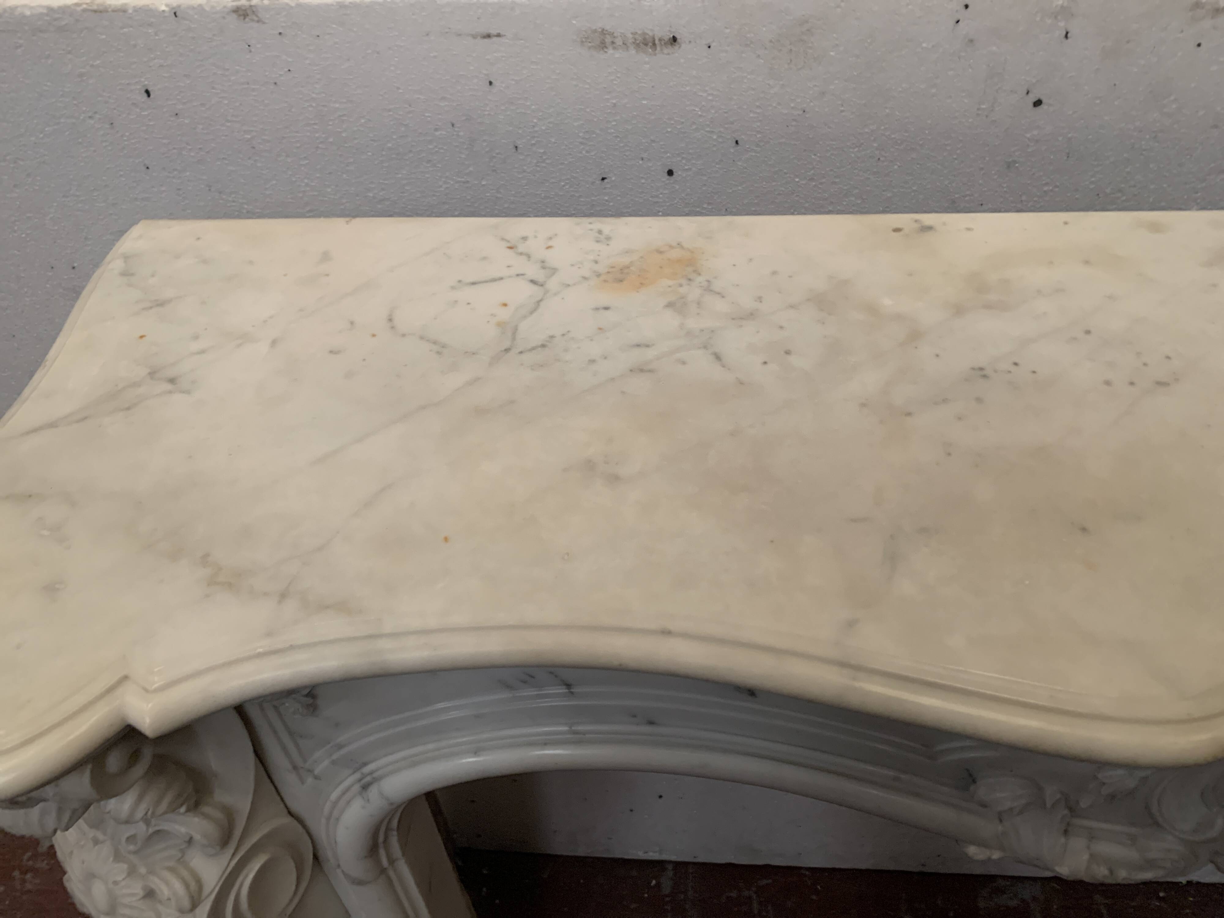 Louis XV style fireplace in white Carrara marble, 19th century