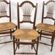 3 wooden and straw chairs, decorated with a sheaf of wheat.