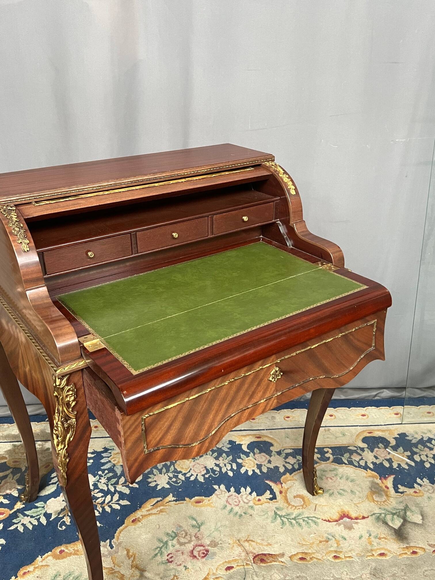 Louis XV style cylinder desk with gilded bronze mounts.
