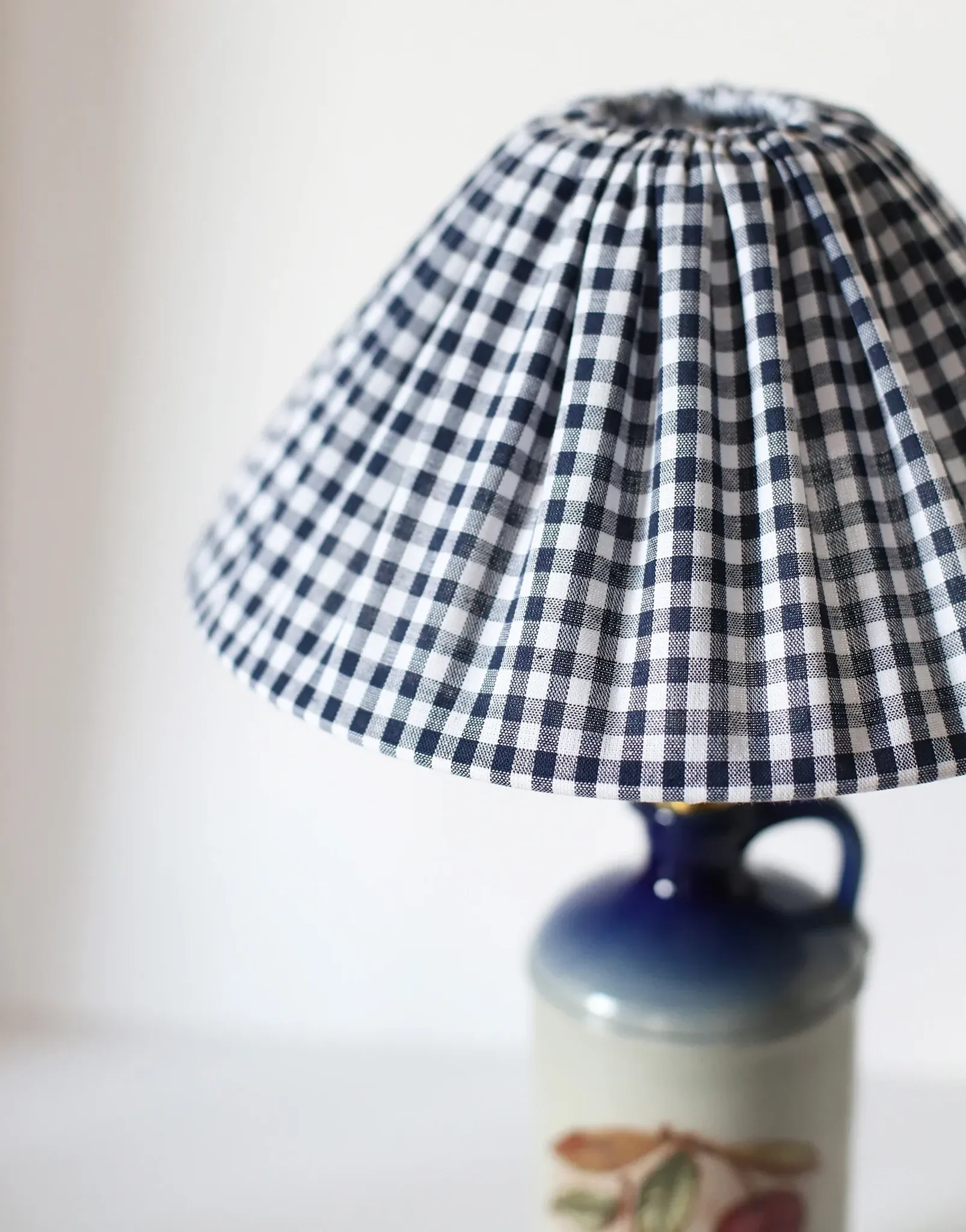 Vintage table lamp Hautlalampe: blue Alsace stone base and pleated Vichy shade.