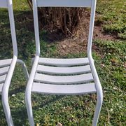 pair of white metal chairs, Tolix style