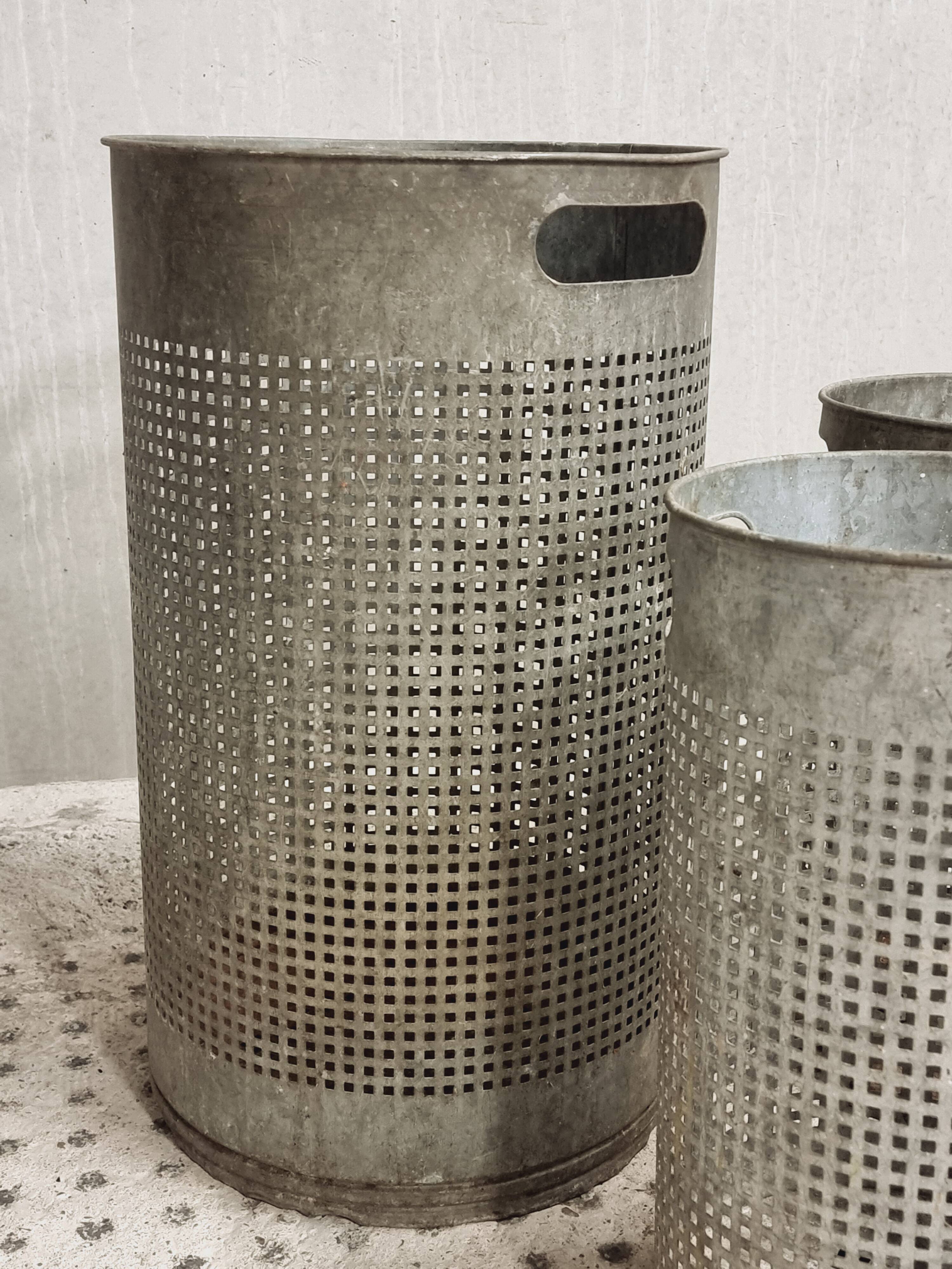Vintage set of perforated metal waste bins