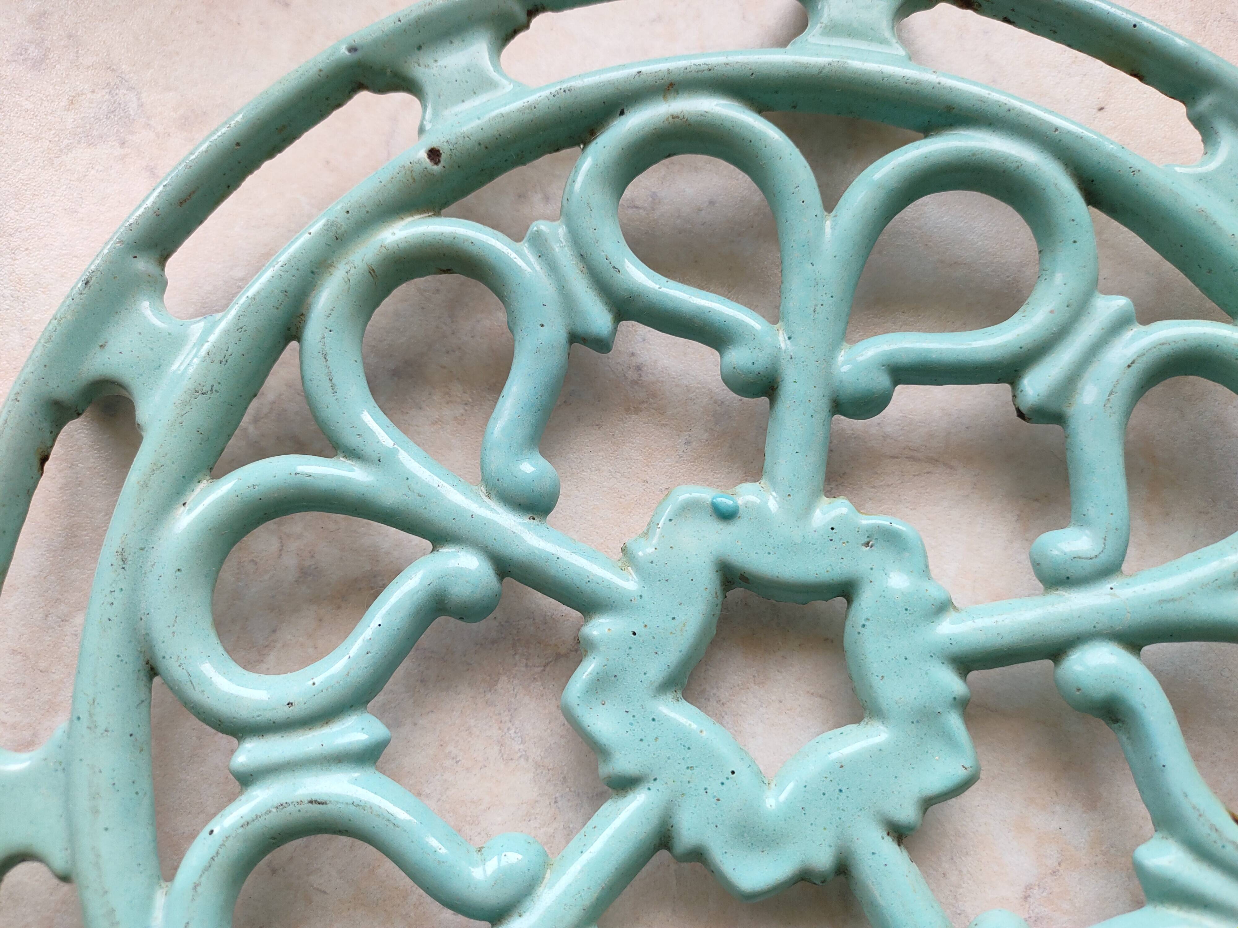 Water green enamelled trivet.
