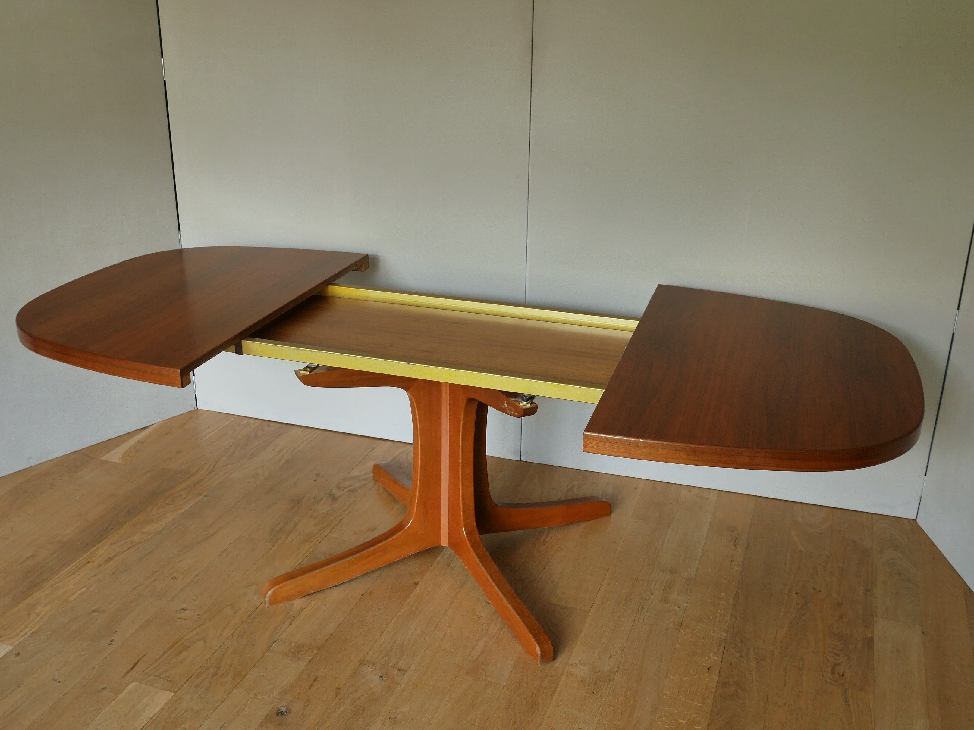 Baumann oval walnut table with extension cords