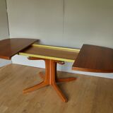 Baumann oval walnut table with extension cords