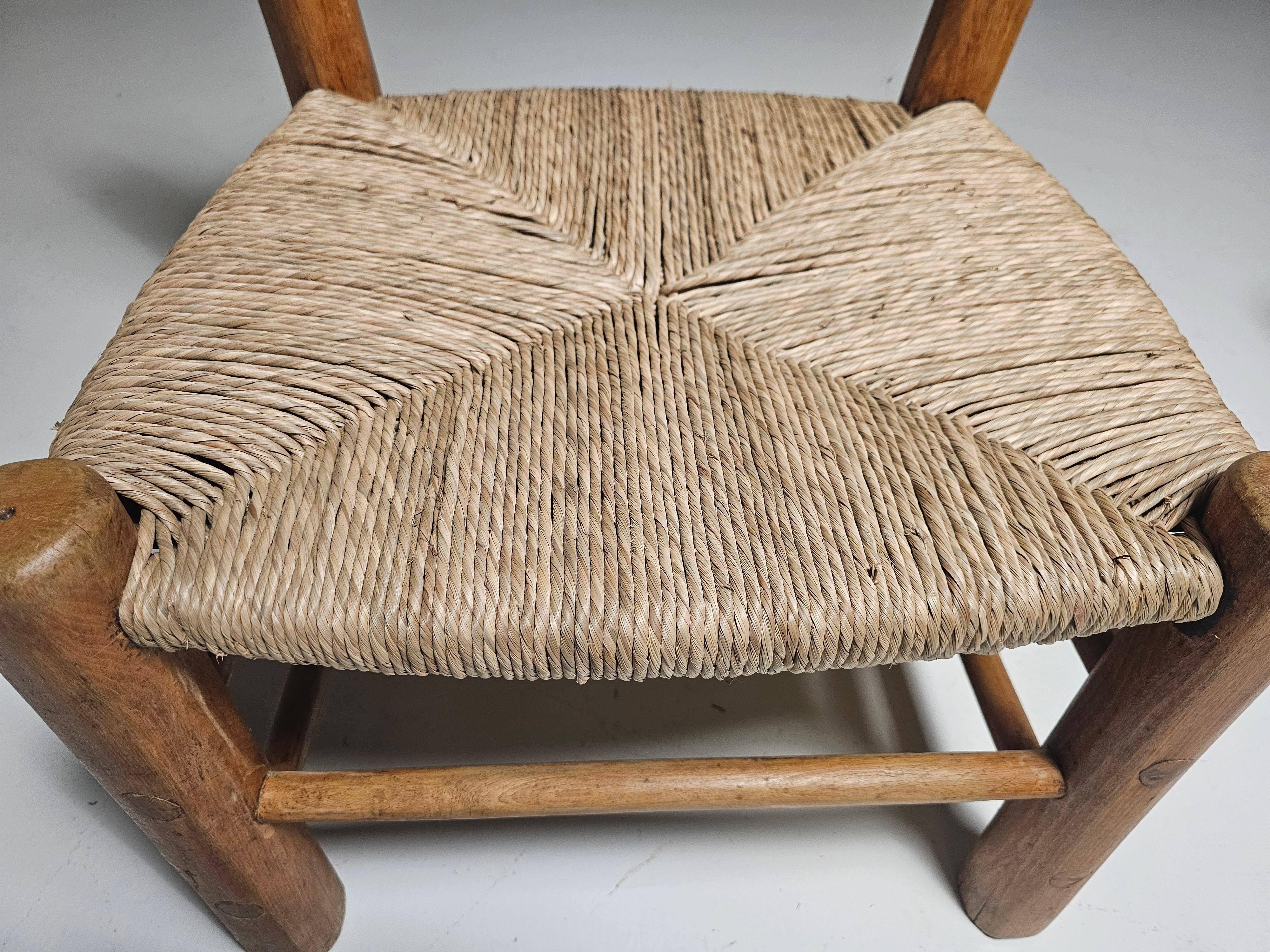 Pair of rustic French low chairs made of elm wood and straw, 1960s.