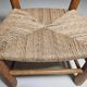 Pair of rustic French low chairs made of elm wood and straw, 1960s.