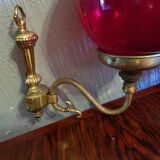 Pair of vintage brass wall light and cherry red globe