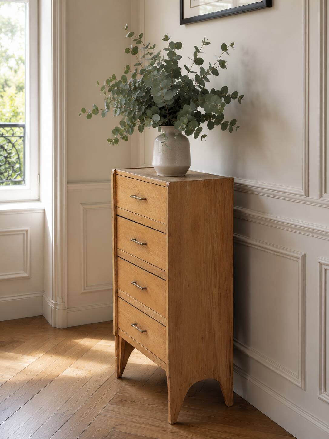 Vintage chest of drawers in raw wood.
