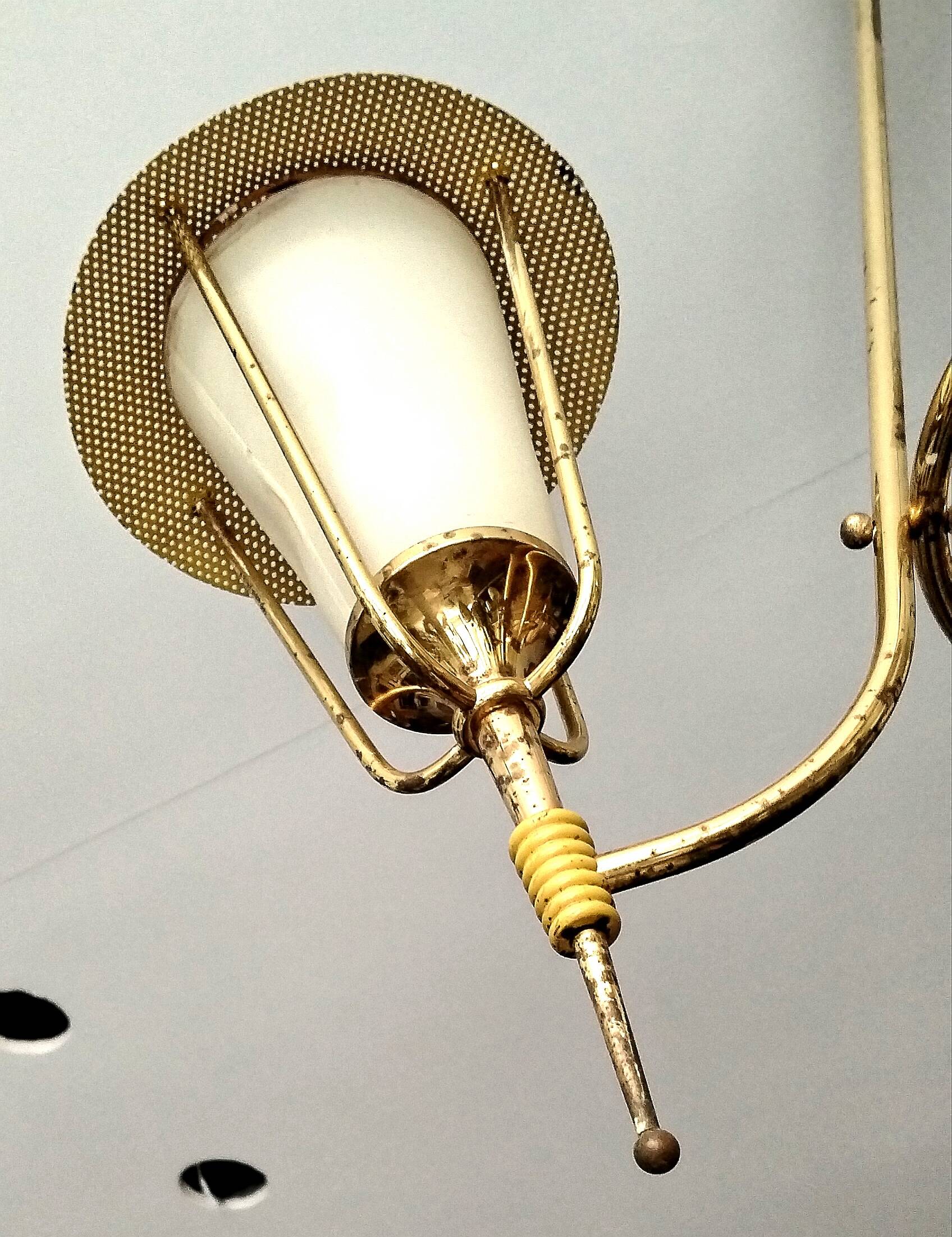 Three-arm pendant light in gilded brass and perforated metal by Maison Arlus Vintage from the 50s