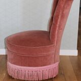 Powder pink fireside chair with fringes