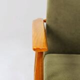 Mid-century modern design armchair in olive green corduroy.