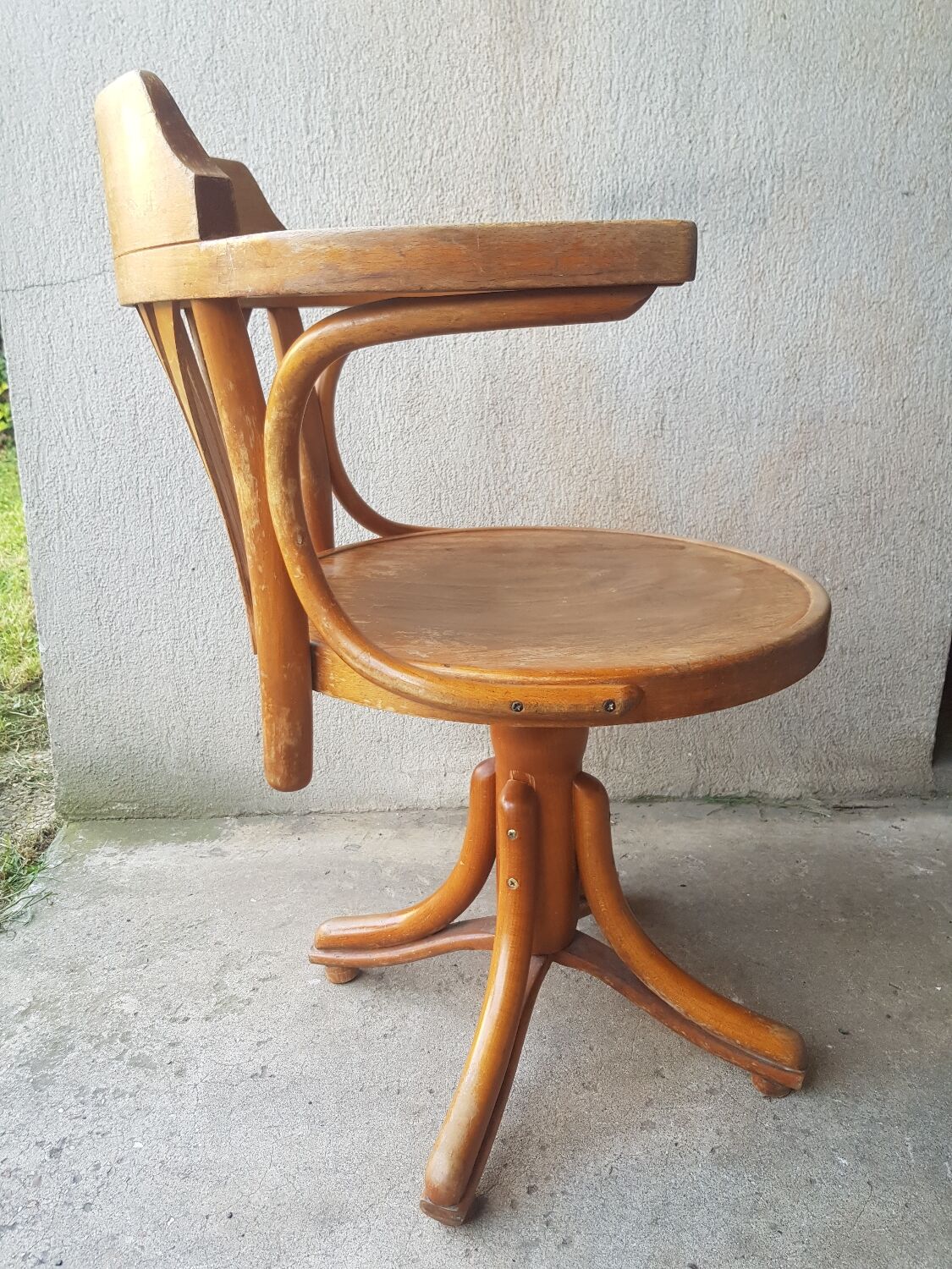 Swivel wooden armchair