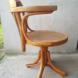 Swivel wooden armchair