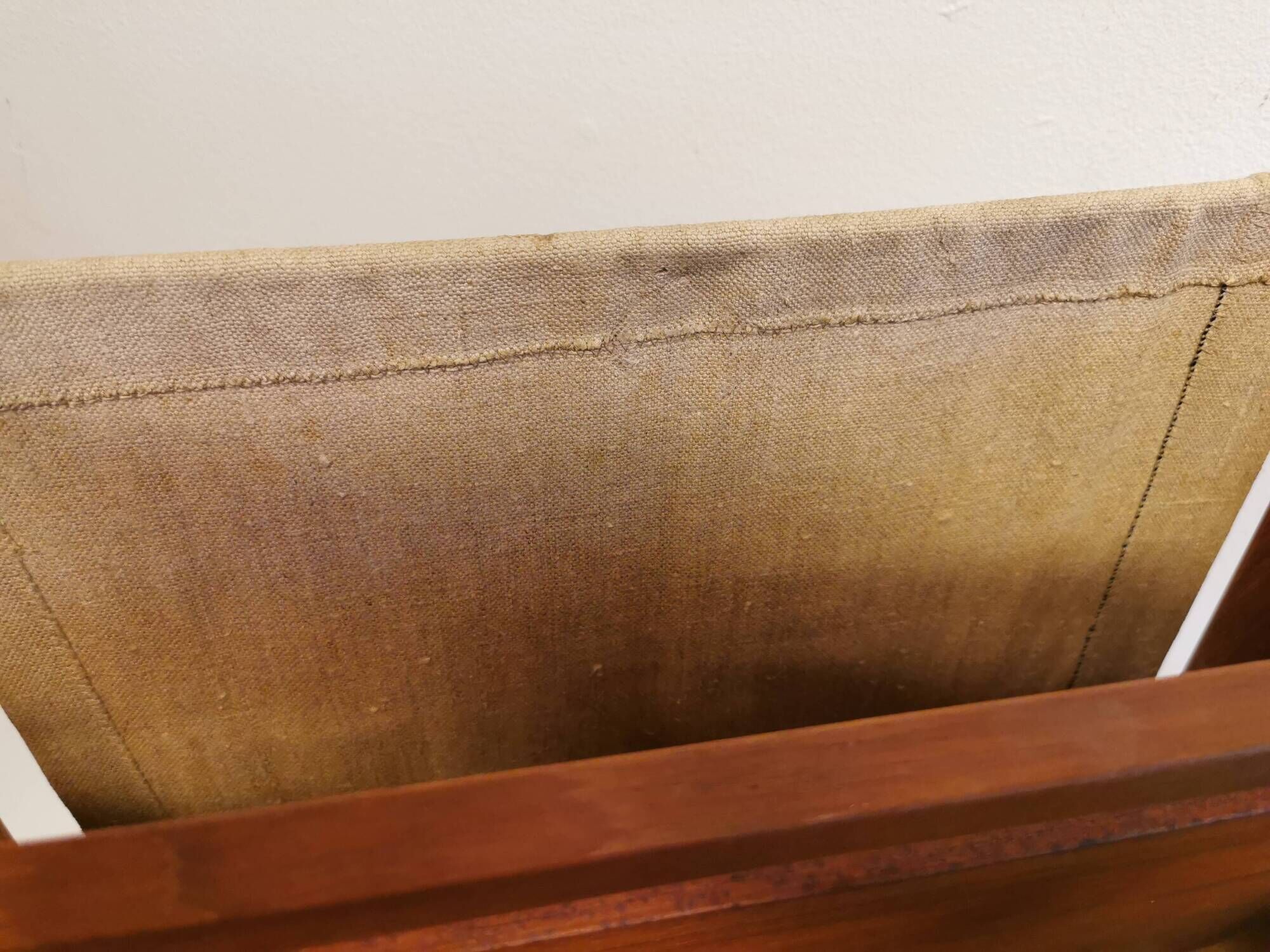 Magazine rack in teak wood with sand-coloured canvas, Danish and from the 1970s.